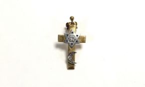 A yellow and white metal mounted cross pendant/ earring set a round brilliant cut diamond