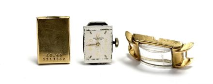 An 18ct gold cased Universal vintage manual wind wristwatch with a champagne dial and arabic