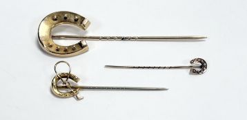 An Edwardian yellow metal lucky horseshoe stick pin 7.5cm 4.9g, together with a 9ct gold lucky