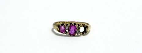 An Edwardian 18ct gold ring set oval pink facet cut ruby approximately 0.02ct flanked by rose cut
