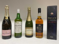 Four bottles: Bell's Special Reserve Whisky, Black & White Whisky, Moët & Chandon Rose Imperial and
