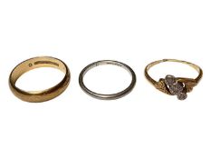 9ct gold wedding ring, platinum wedding ring and 18ct gold diamond three stone cross-over ring (3)