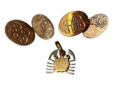 Pair of 9ct rose gold cufflinks with engraved initials RB and a yellow and white metal crab pendant