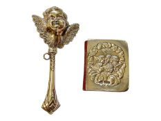 Silver baby rattle with cupid head and wings decoration, 12cm, together with a silver mounted miniat