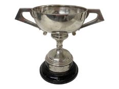 Large silver two handled trophy (Chester 1911) on an ebonised wood base with an applied white metal