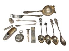 Group of silver items to include an Edwardian novelty shoe, Victorian sovereign holder, tea strainer