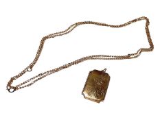 9ct gold back and front rectangular locket and a yellow metal chain (2)