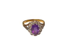 Amethyst and diamond oval cluster ring in 18ct gold setting