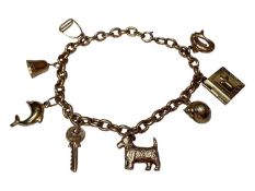 9ct gold charm bracelet with eight novelty charms