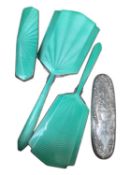 Sterling silver mounted brush (stamped sterling 70) and a three piece silver plated and green guillo