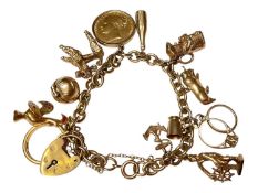 Gold charm bracelet with a Victorian gold full sovereign 1872, 22ct gold wedding ring, various 9ct g