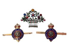 Pair of gold enamelled bar brooches, both with makers mark BN, and a paste set white metal floral br