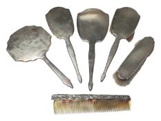 1930s silver mounted four piece dressing table set, together with another silver backed hand mirror