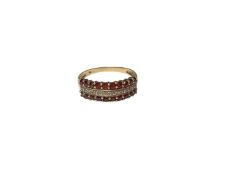 Diamond and garnet ring with a triple band of stones, in 9ct gold setting