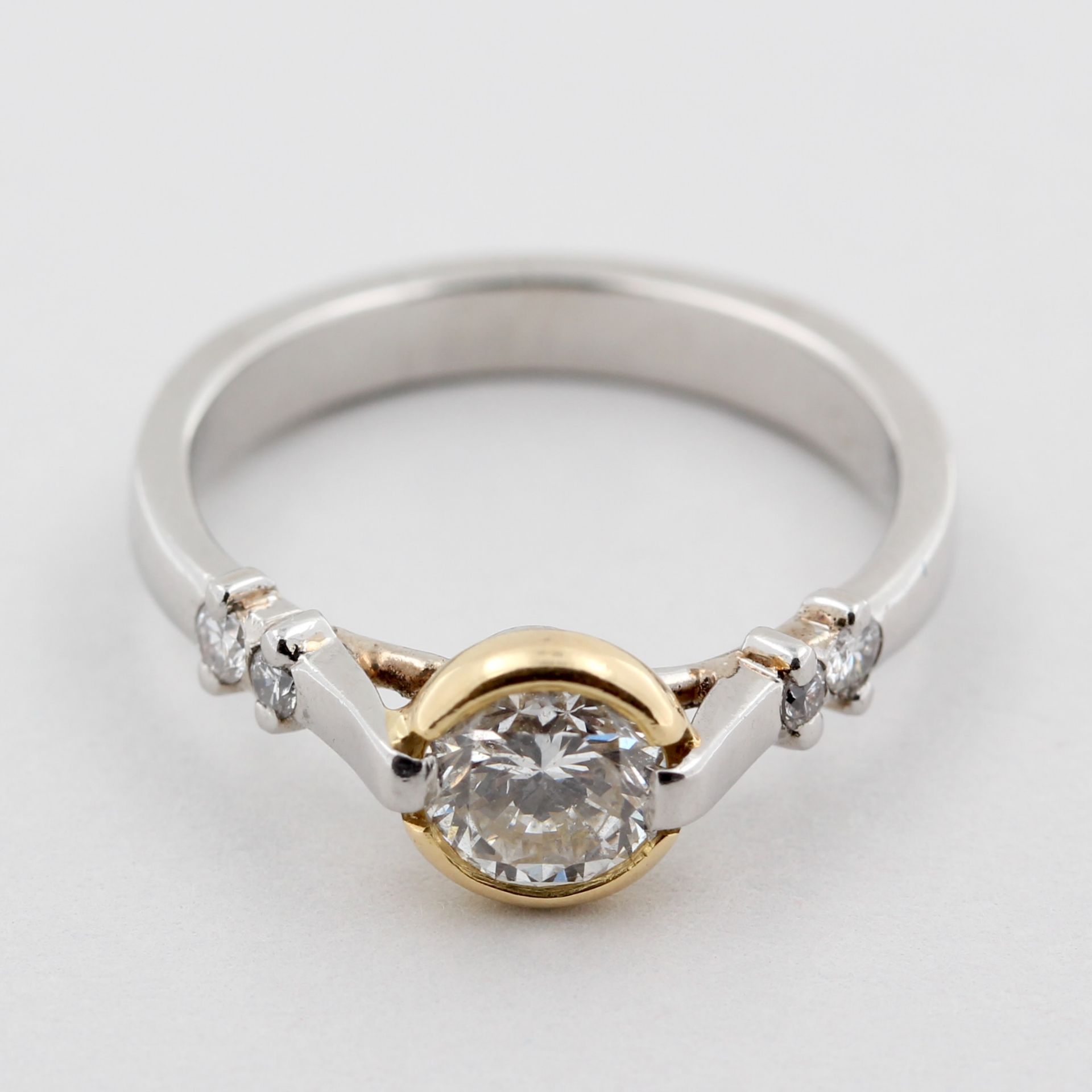 Solitärring, 950 Platin, teils Gelbgold, mit 1 Brillant, ca. 0,60 ct, weiß, si, ca. 4,5 g, RM 51,5