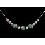 Collier, 18 kt Weißgold, 11 bewegliche Kugeln, Diamant- und Tsavoritbesatz, zusammen ca. 0,80 ct, an