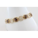 Armband Fries-Arauner, 14 kt Gelbgold, mit 9 wohl Topasen (Steine teils mit Gebrauchsspuren),
