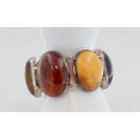Armband mit Bernstein, 925 Silber, mit großen Bernstein Cabochons, B. 3,1 cm - 4,3 cm, L. 18,5 cm,