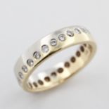 Memoryring, 14 kt Gelbgold und Weißgold, mit Brillanten, zusammen ca. 0,47 ct, ca. 3,4 g, RM 50