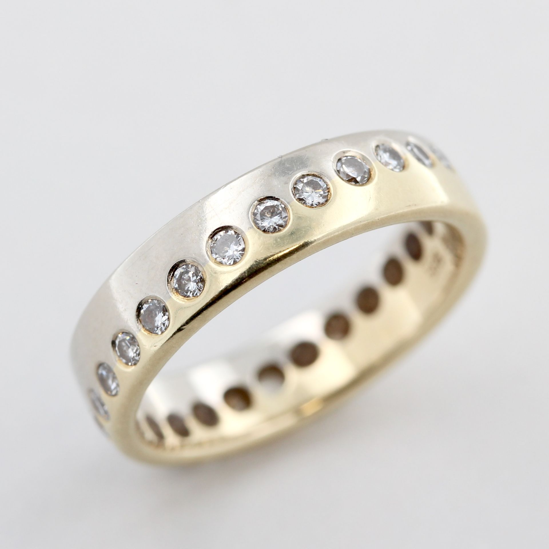 Memoryring, 14 kt Gelbgold und Weißgold, mit Brillanten, zusammen ca. 0,47 ct, ca. 3,4 g, RM 50