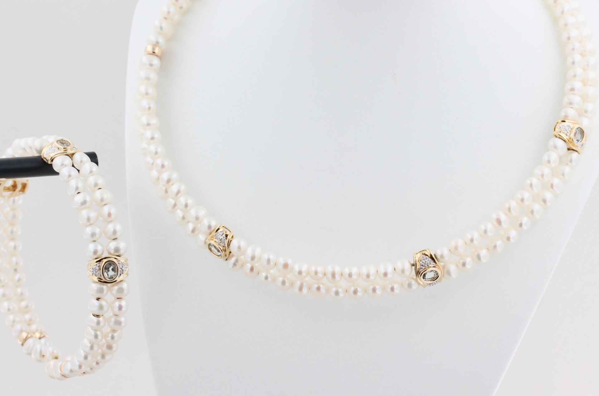 Schmuckset, 14 kt Gelbgold, Zwischenteile, teils mit kleinen Brillanten und Aquamarinen, punziert,