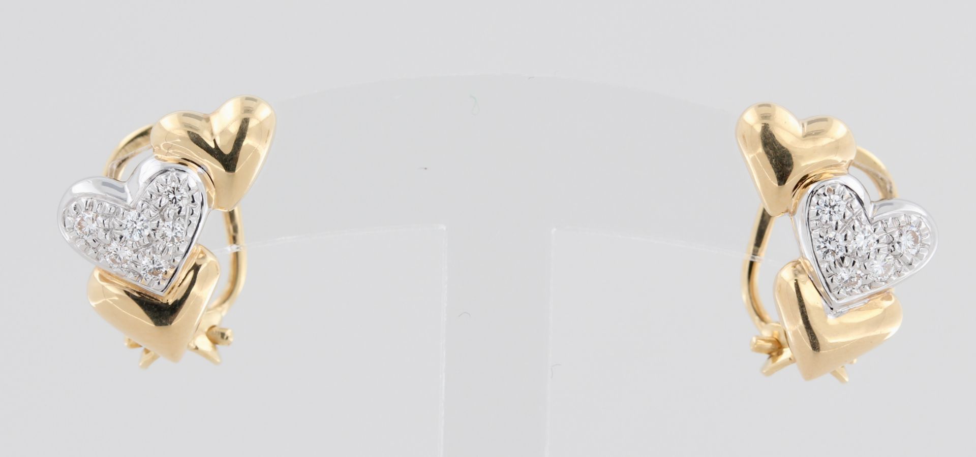 Paar Ohrstecker, 18 kt Gelbgold, teils Weißgold, mit Brillanten, punziert, ca. 6,3 g, L. 1,6 cm