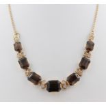 Collier, 14 kt Gelbgold, mit 7 wohl Topasen, punziert, ca. 27,1 g, L. 41 cm