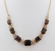 Collier, 14 kt Gelbgold, mit 7 wohl Topasen, punziert, ca. 27,1 g, L. 41 cm