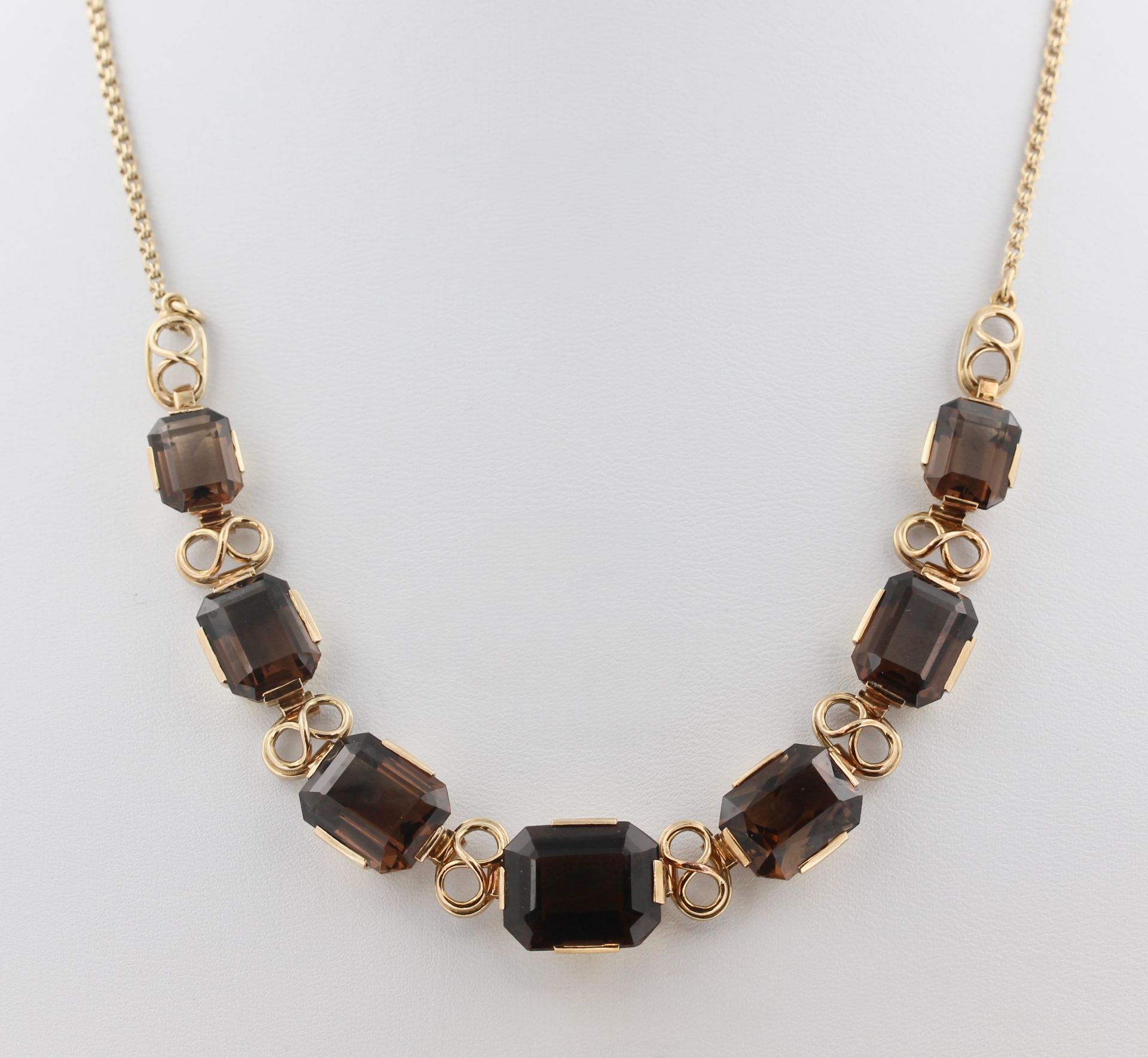 Collier, 14 kt Gelbgold, mit 7 wohl Topasen, punziert, ca. 27,1 g, L. 41 cm