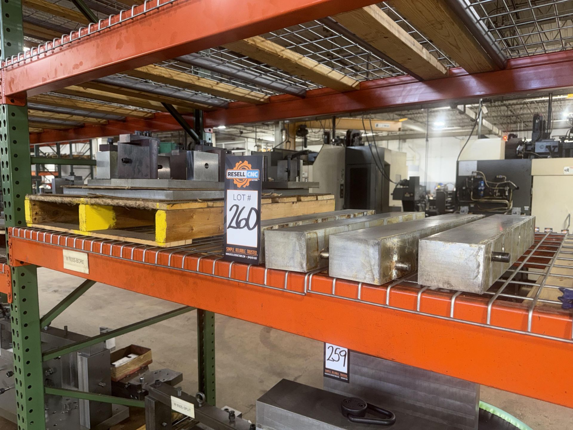 1 Skid of Machining Fixtures & (4) Bars of Steel