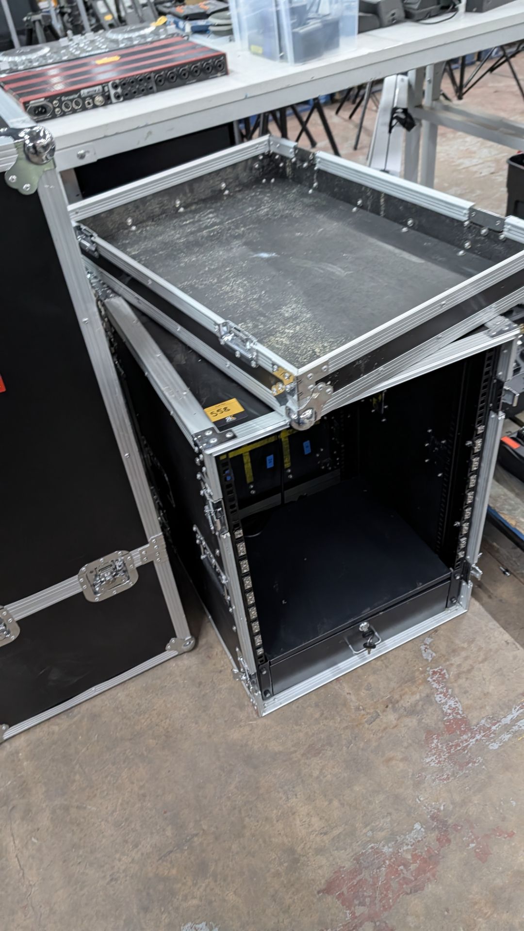 Flight Case with rack mounting brackets down each side and drawer at the bottom.