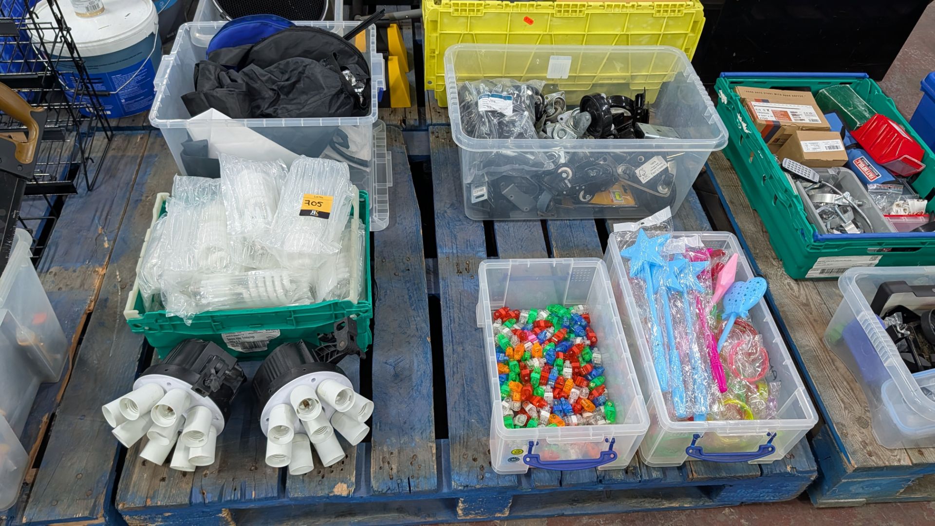 The contents of a Pallet of miscellaneous Items. Including Brackets and Casters, Bulbs, Coloured Con