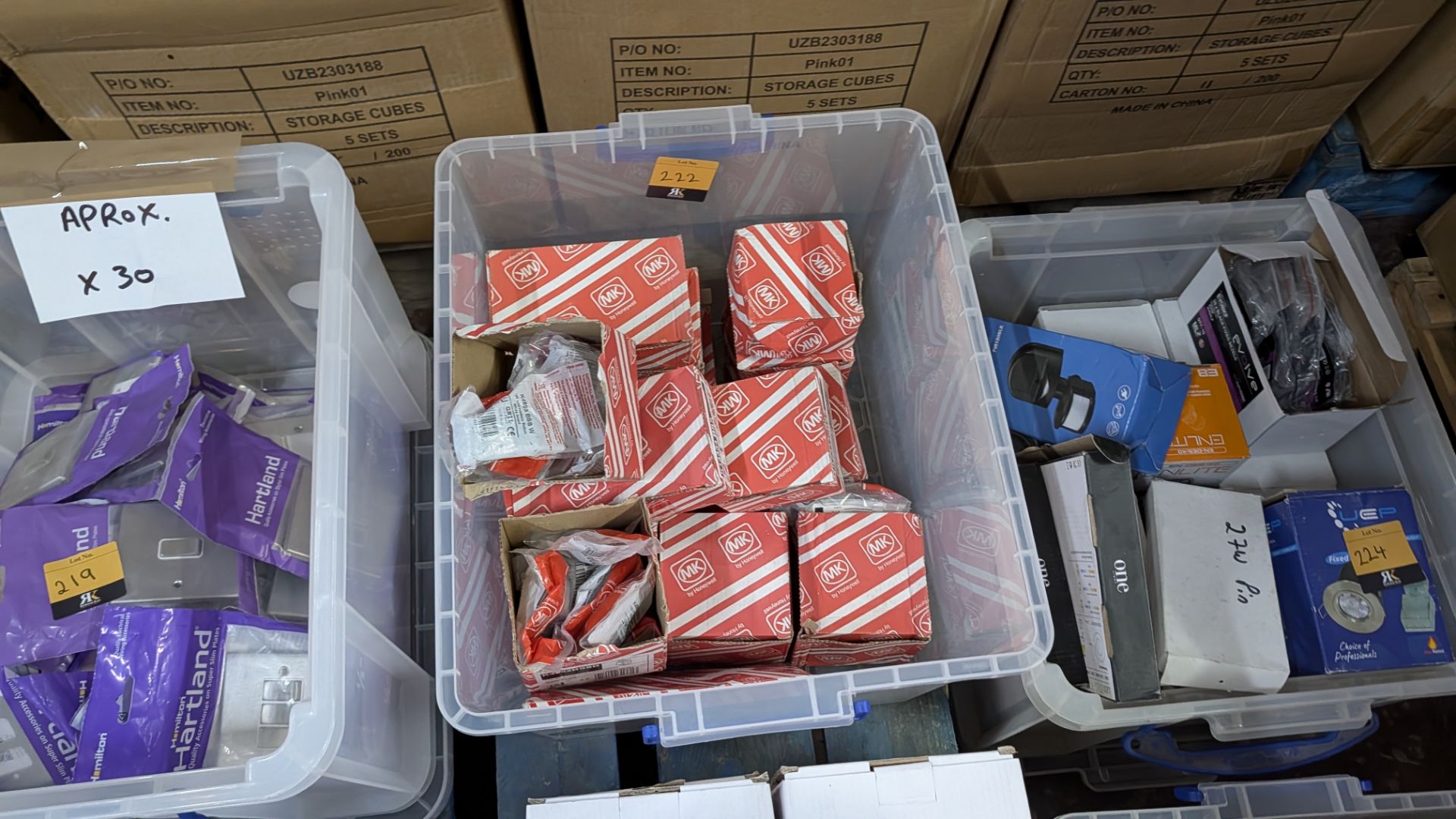 The contents of a Crate of Assorted MK Modular Front Plates, Switches and More.