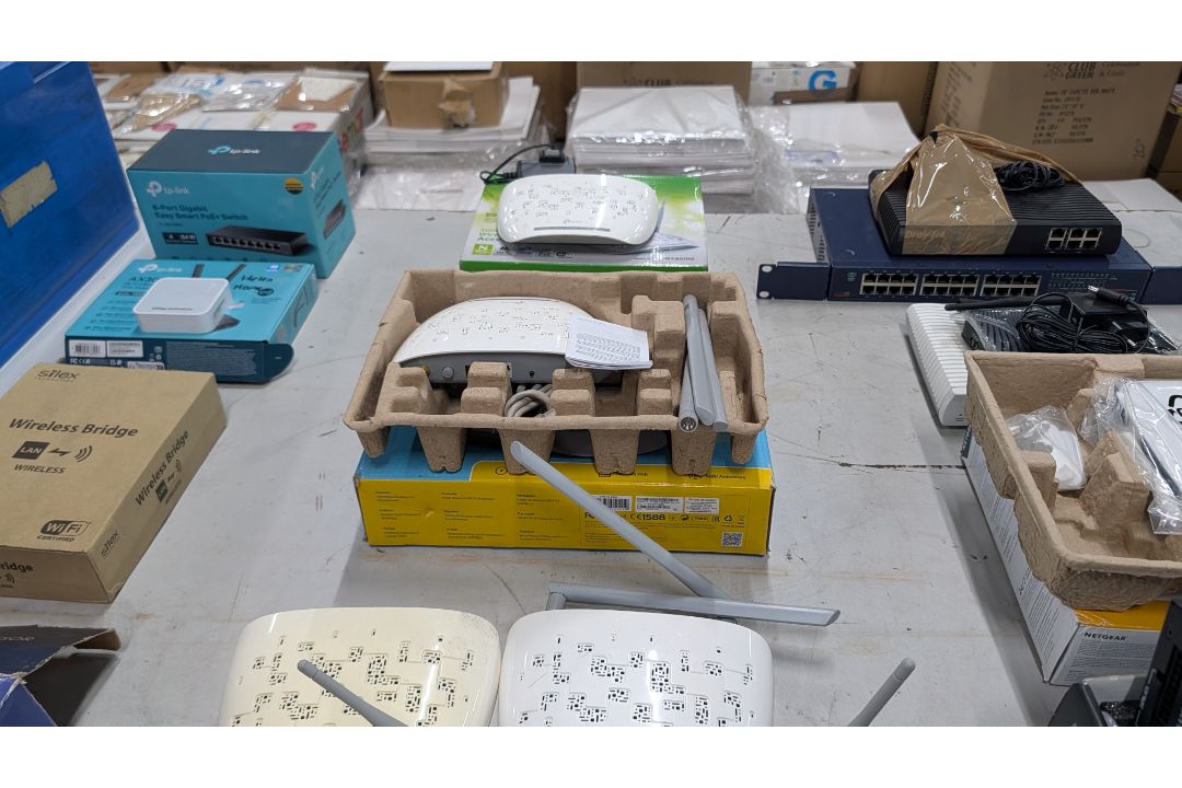 The contents of a Table of Assorted Switches, Routers and other Networking Items. - Image 11 of 19