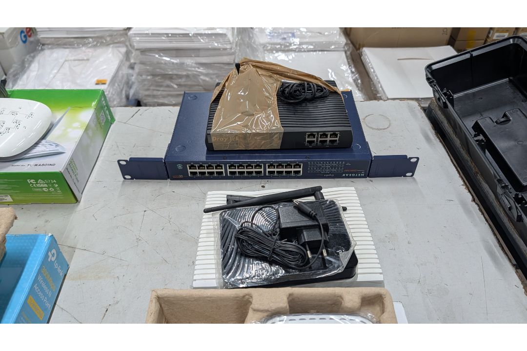 The contents of a Table of Assorted Switches, Routers and other Networking Items. - Image 9 of 19