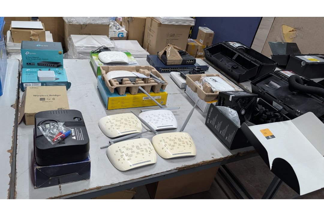 The contents of a Table of Assorted Switches, Routers and other Networking Items. - Image 15 of 19