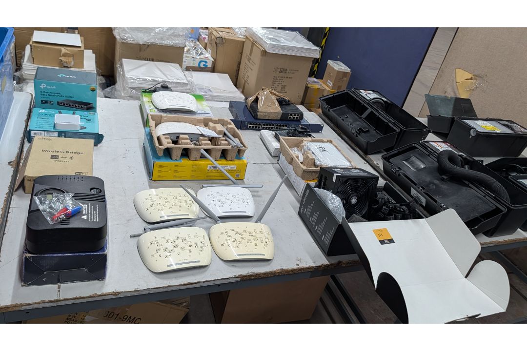 The contents of a Table of Assorted Switches, Routers and other Networking Items. - Image 19 of 19