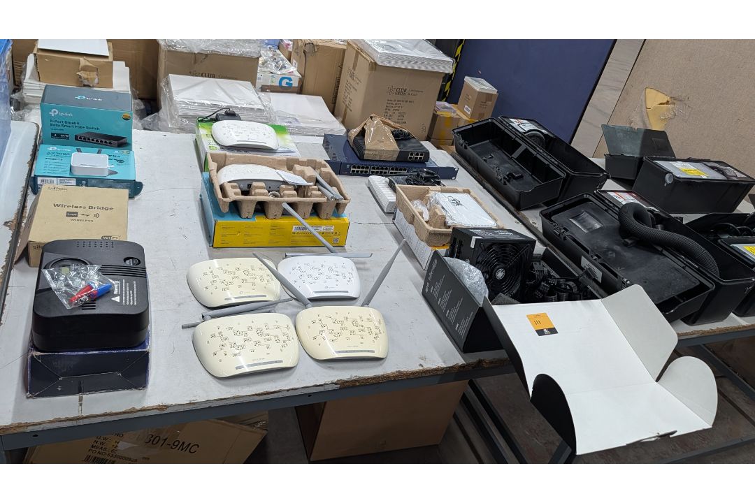 The contents of a Table of Assorted Switches, Routers and other Networking Items. - Image 18 of 19
