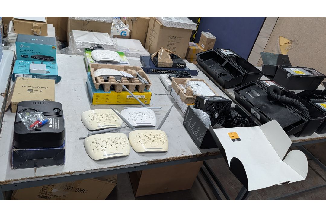 The contents of a Table of Assorted Switches, Routers and other Networking Items. - Image 17 of 19