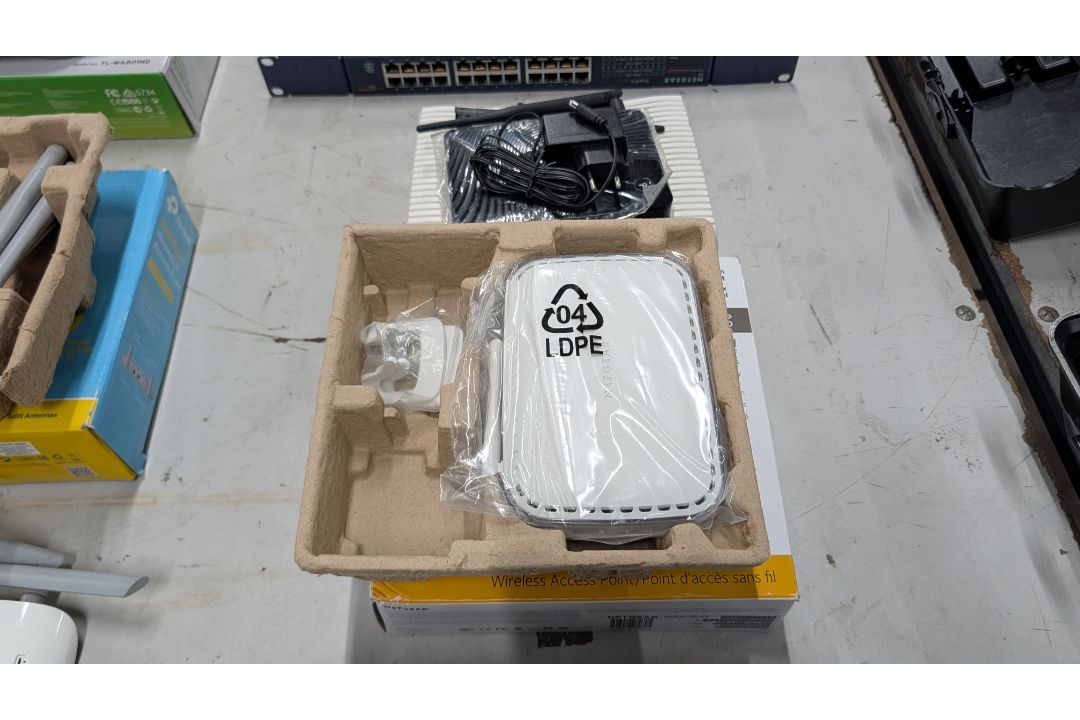 The contents of a Table of Assorted Switches, Routers and other Networking Items. - Image 6 of 19