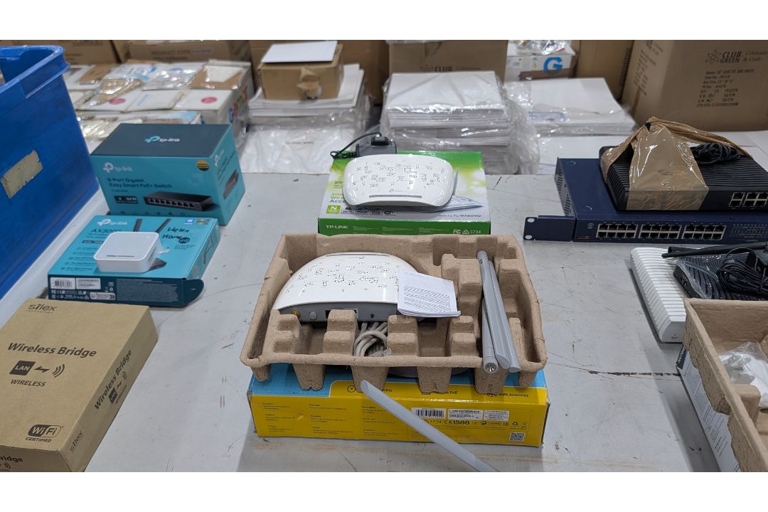 The contents of a Table of Assorted Switches, Routers and other Networking Items. - Image 12 of 19