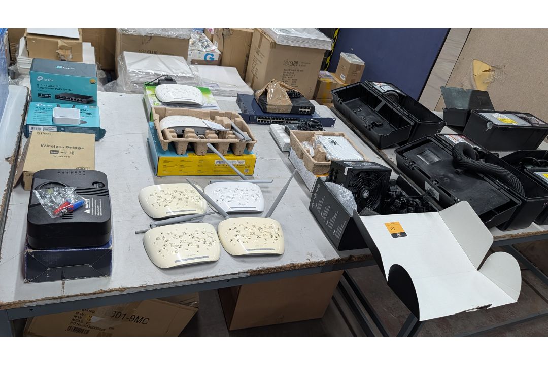 The contents of a Table of Assorted Switches, Routers and other Networking Items. - Image 16 of 19