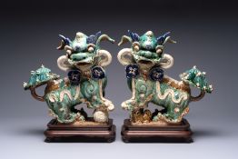 A pair of large Chinese polychrome-glazed Shiwan stoneware Buddhist lions, 19th C.