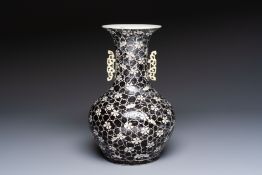 A rare Chinese famille noire 'Prunus on Cracked Ice' vase with 'Chilong' handles, 19th C.