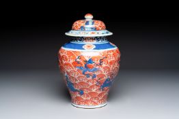 A Chinese blue, white and iron-red decorated 'Mythical Animals' vase and cover, 19th C.