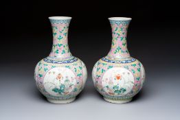 A pair of Chinese famille rose pink-ground 'Ping An Bai Sui' bottle vases, 19th C.