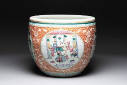 A large Chinese famille rose coral-red-ground fish bowl with narrative design, 19th C.