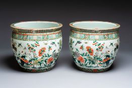 A pair of Chinese famille verte 'Flowers and Butterflies' fishbowls, 19th C.
