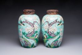A pair of fine Chinese famille verte turquoise-ground 'Magpie and Prunus' jars with reticulated wood