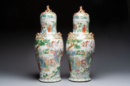 A pair of Chinese famille rose '18 Luohan' vases and covers, 19th C.